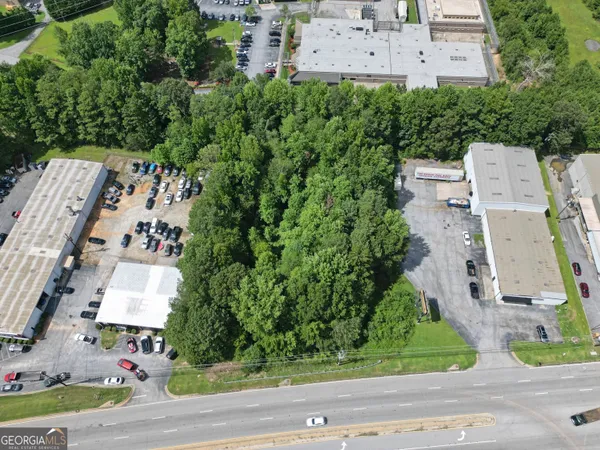 an aerial view of a house with a yard and garden space