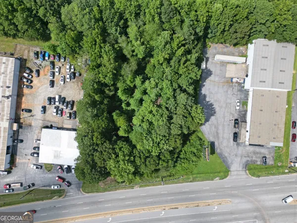 a aerial view of a house with a yard and garden