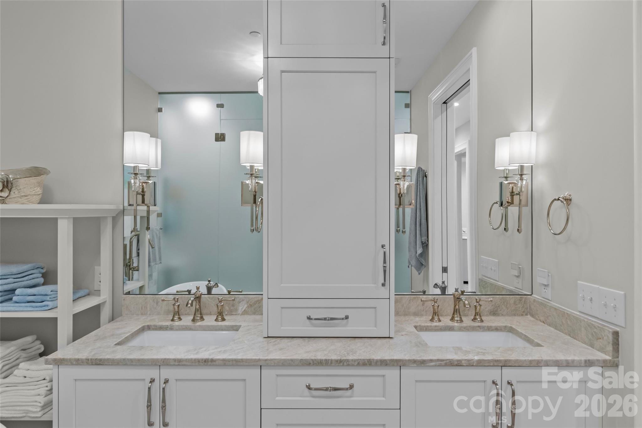 1500 Queens Road, Unit 104 Charlotte, NC 28207 - Photo 28 of 41 a bathroom with double vanity sinks and a mirror