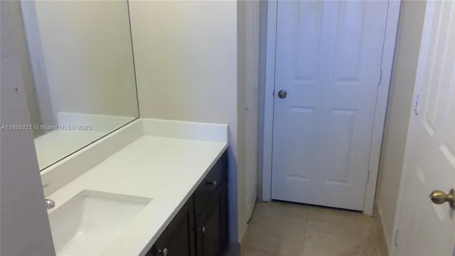 a bathroom with a sink and a shower