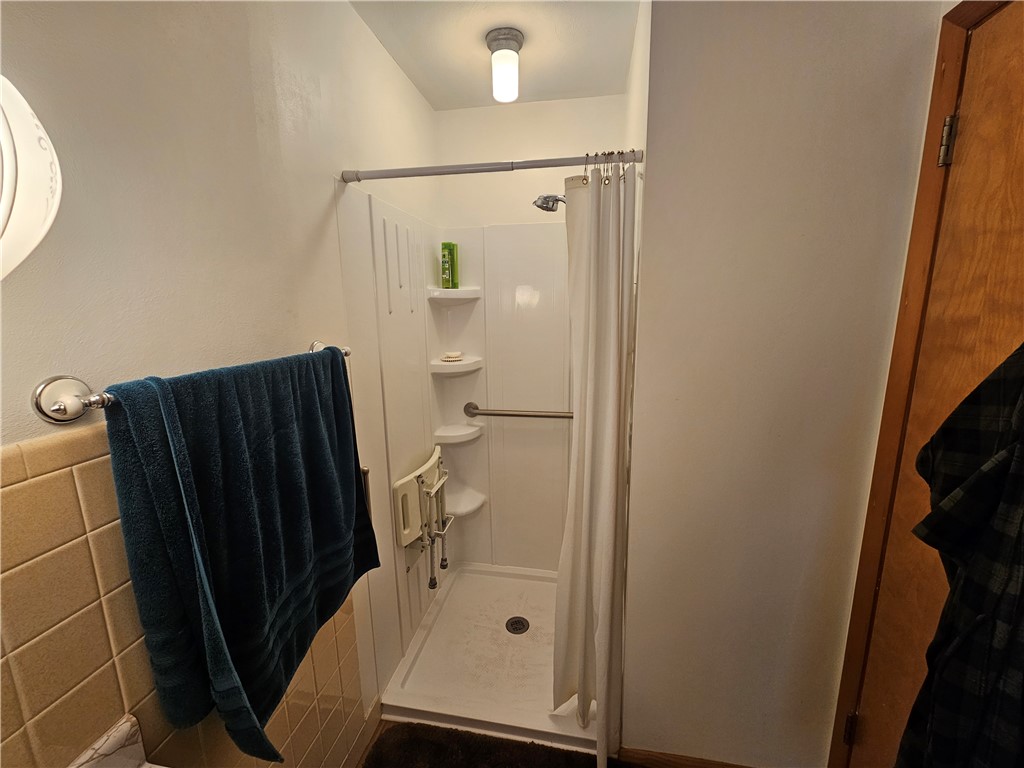3998 Willowcrest Road Beavercreek, OH 45430 - Photo 25 of 41 This bathroom features a functional shower area with accessible design elements.