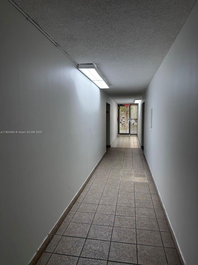 11790 Southwest 18th Street, Unit 1073 Miami, FL 33175 - Photo 20 of 25 a view of hallway with window