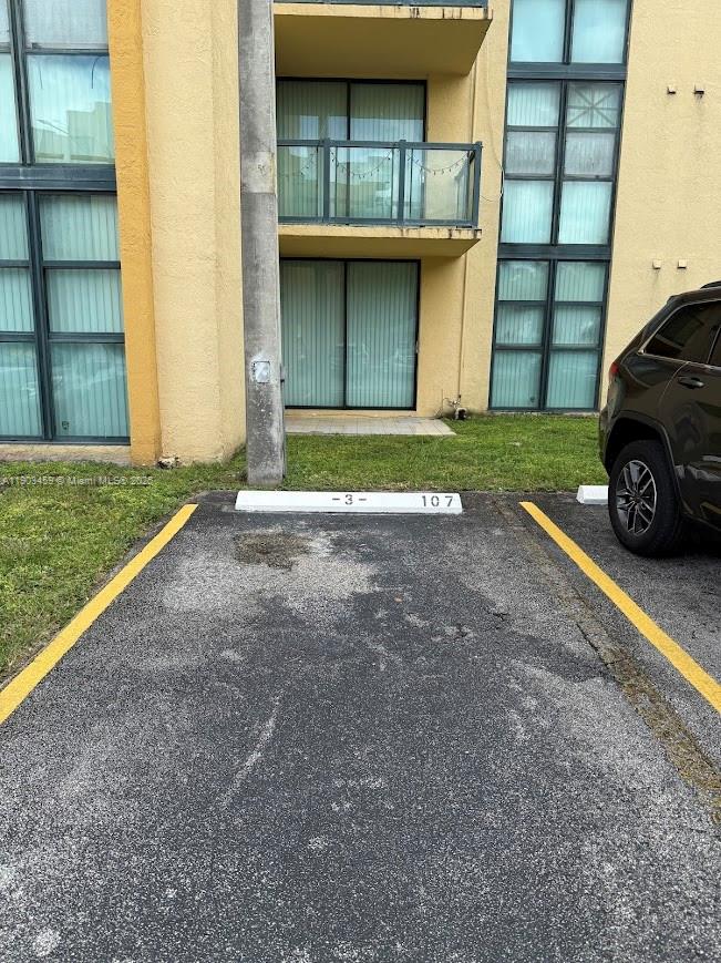 11790 Southwest 18th Street, Unit 1073 Miami, FL 33175 - Photo 2 of 25 a view of a car parked front of a house