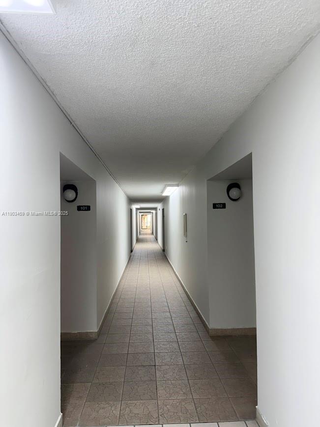 11790 Southwest 18th Street, Unit 1073 Miami, FL 33175 - Photo 21 of 25 a view of hallway with window and stairs