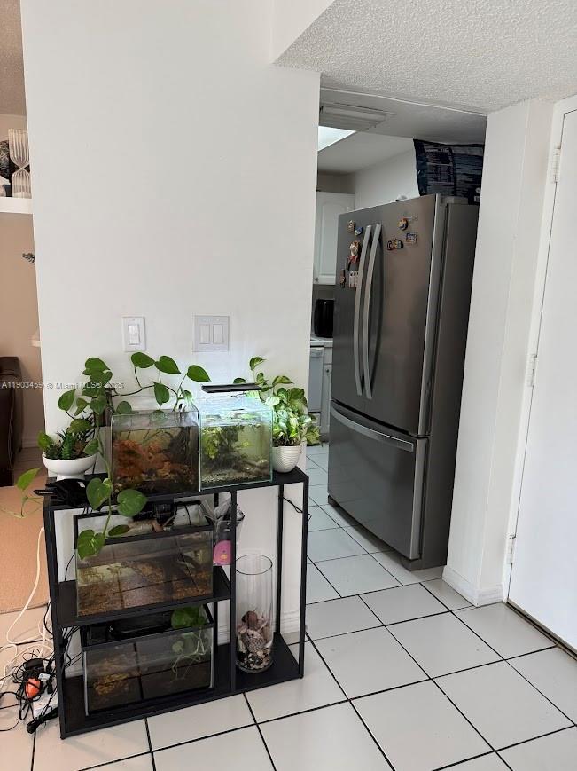 11790 Southwest 18th Street, Unit 1073 Miami, FL 33175 - Photo 7 of 25 a kitchen with stainless steel appliances a refrigerator and a counter