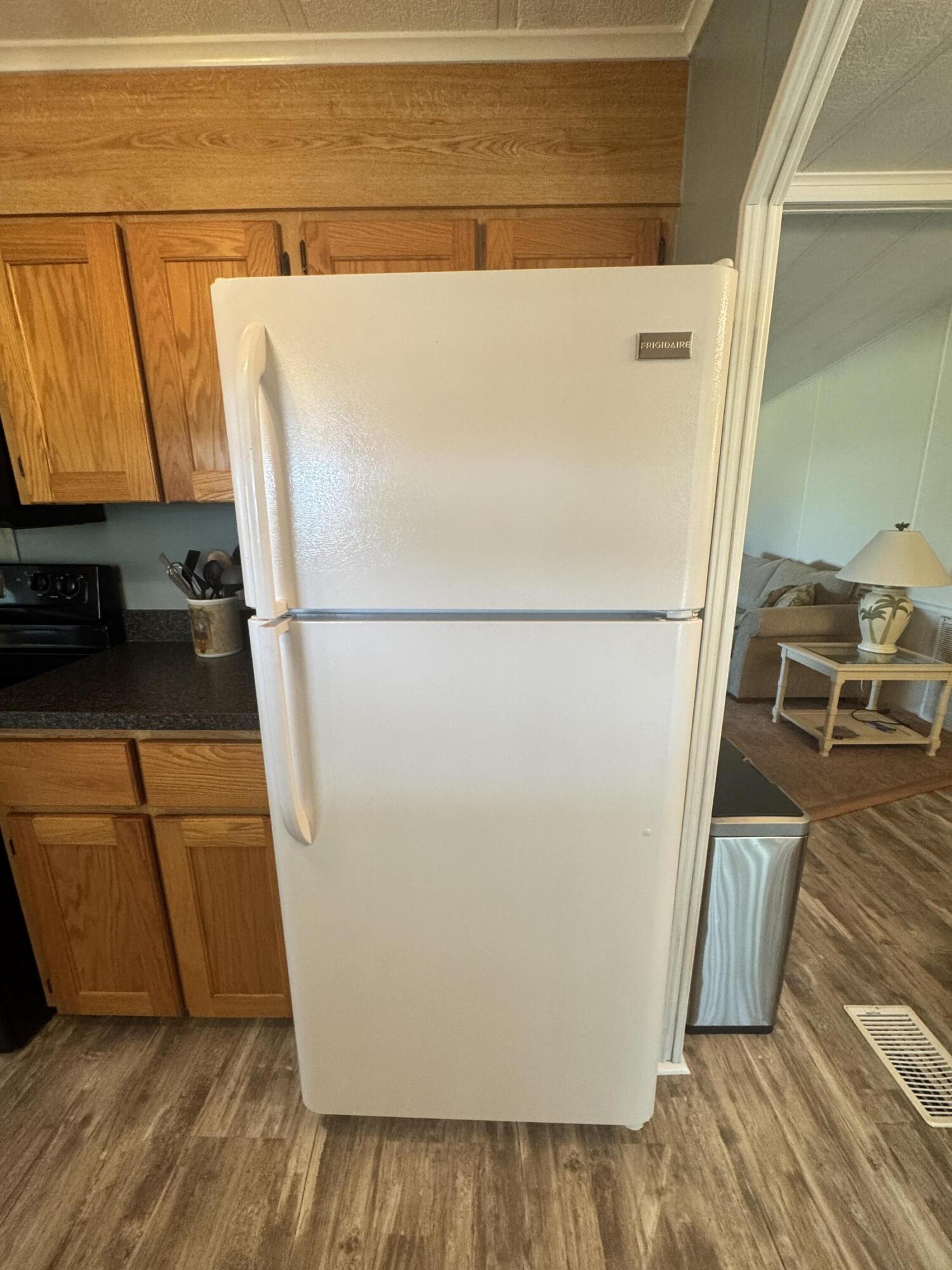 9 San Felipe Fort Pierce, FL 34951 - Photo 13 of 36 a white refrigerator freezer sitting in a kitchen