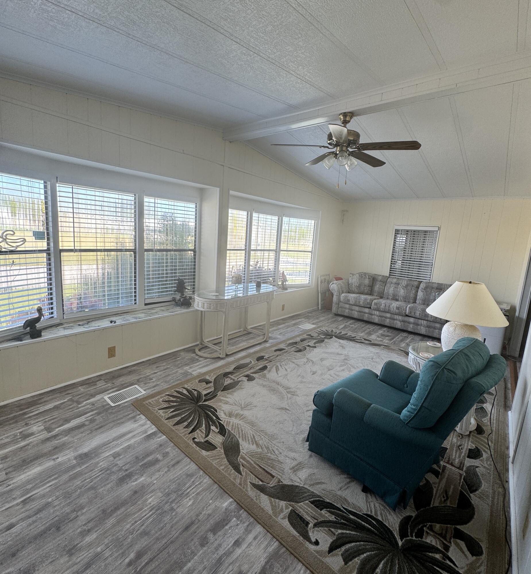 9 San Felipe Fort Pierce, FL 34951 - Photo 24 of 36 a living room with furniture and a window