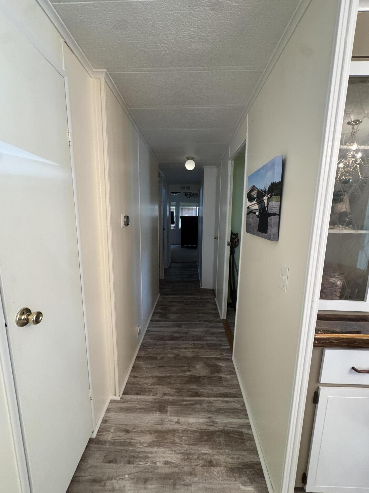 9 San Felipe Fort Pierce, FL 34951 - Photo 25 of 36 a view of a hallway with wooden floor and staircase