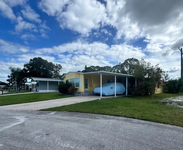 a view of a backyard of the house