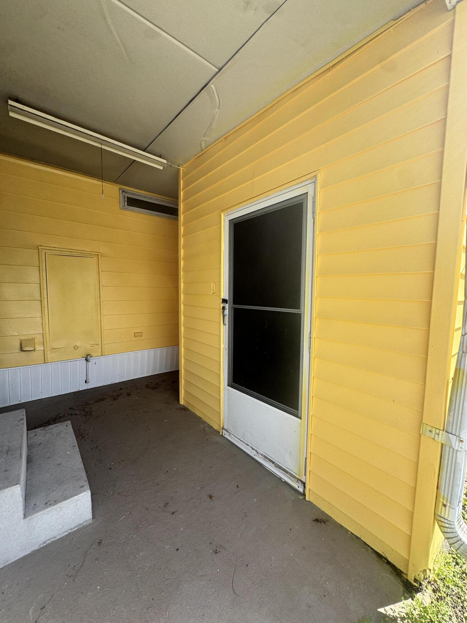 9 San Felipe Fort Pierce, FL 34951 - Photo 4 of 36 a view of an empty room with a window