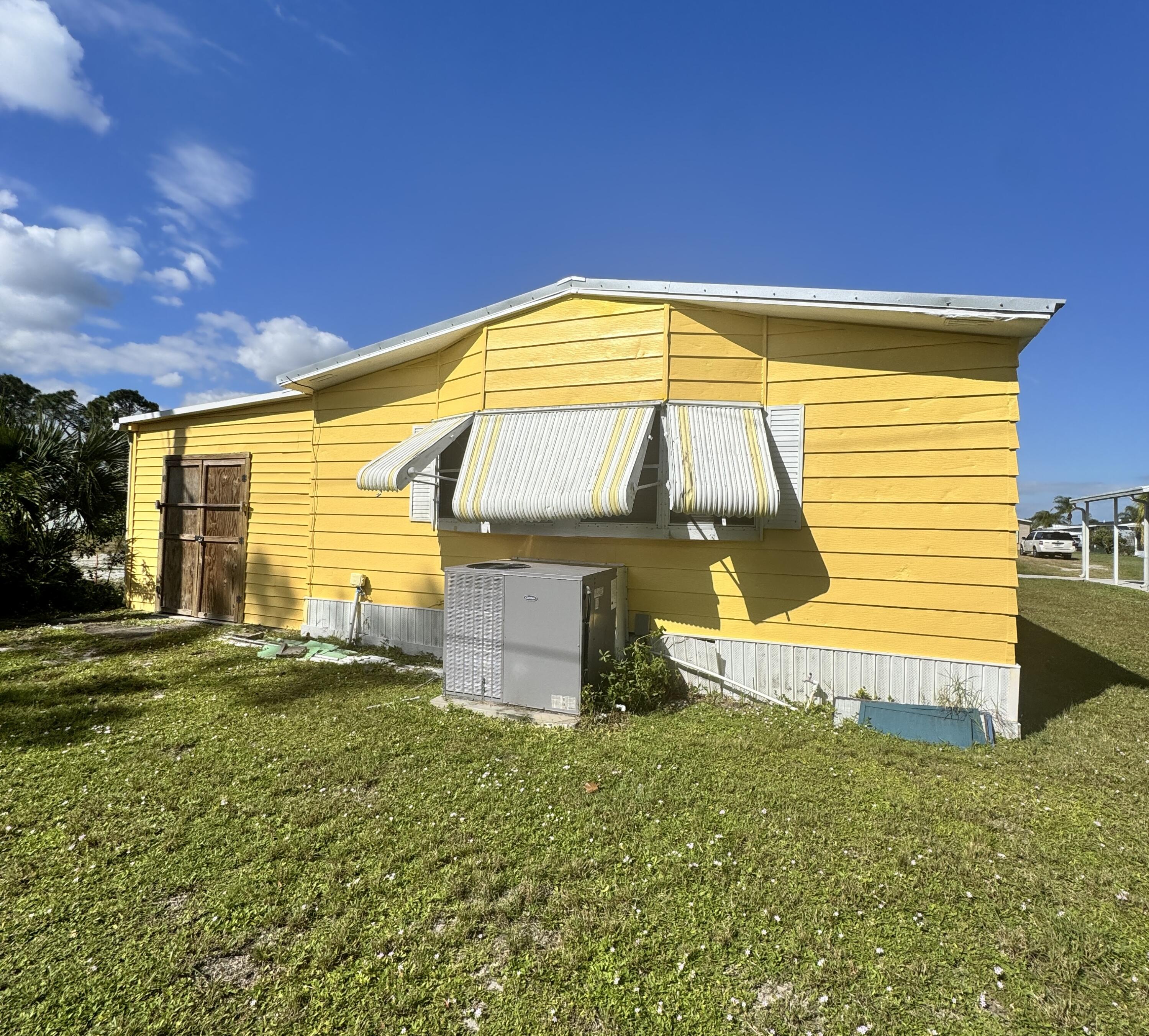 9 San Felipe Fort Pierce, FL 34951 - Photo 6 of 36 a view of a house with a yard