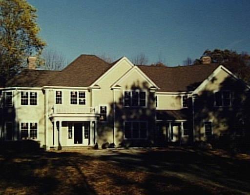 1 Lynch Brook Lane Ridgefield, CT 06877 - Photo 1 of 1 a front view of a house with a yard