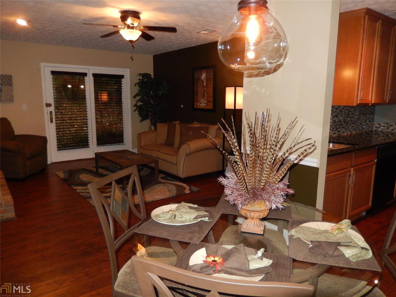 1206 McClelen Way Decatur, GA 30033 - Photo 1 of 1 a living room with furniture and a fireplace