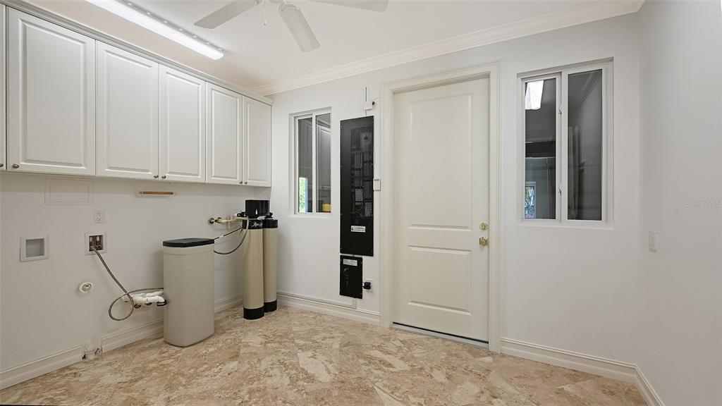 725 Penfield Street Longboat Key, FL 34228 - Photo 20 of 33 a view of a storage & utility room with closet