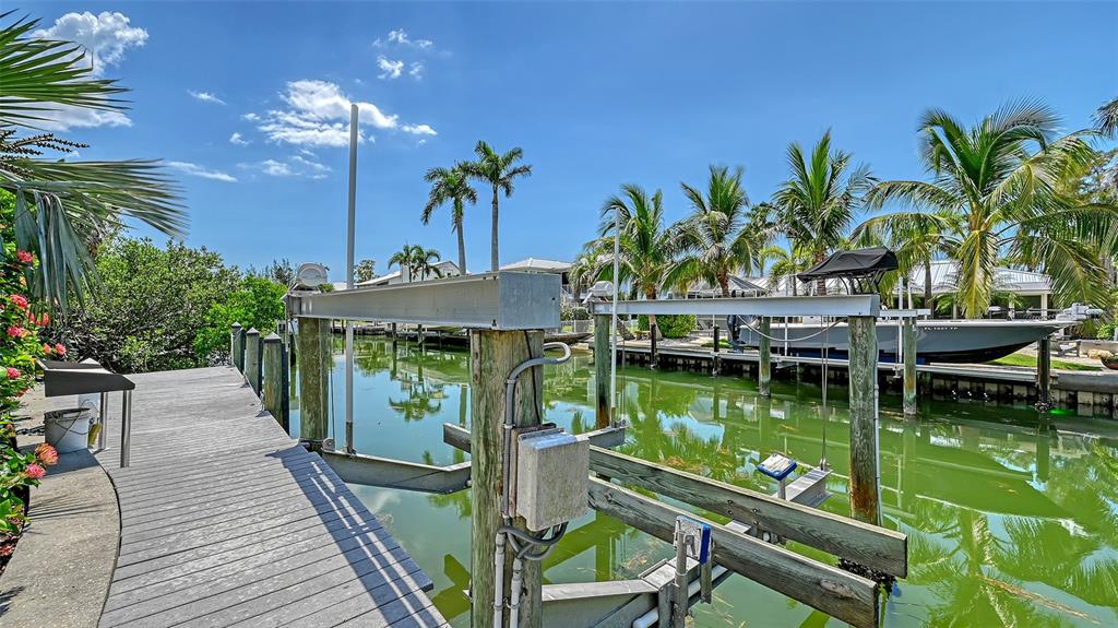 725 Penfield Street Longboat Key, FL 34228 - Photo 28 of 33 a view of a house with pool and wooden floor