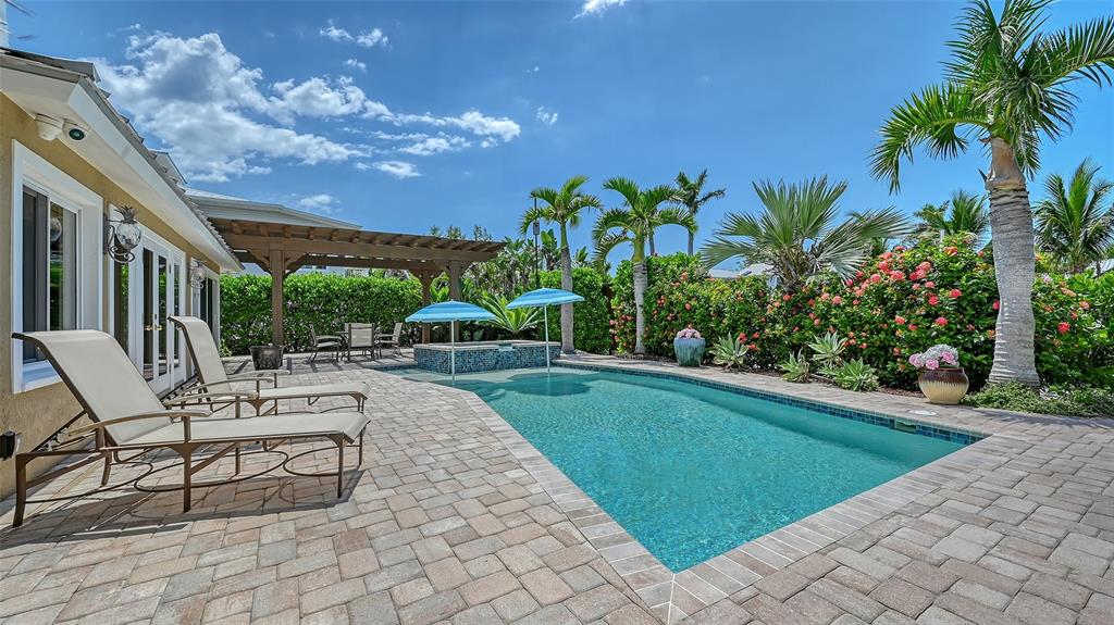 725 Penfield Street Longboat Key, FL 34228 - Photo 30 of 33 a view of a backyard with sitting area