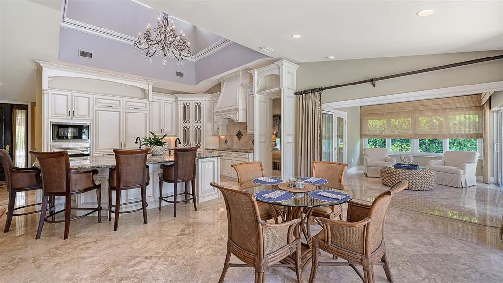 725 Penfield Street Longboat Key, FL 34228 - Photo 9 of 33 a view of a dining room with furniture window and outside view