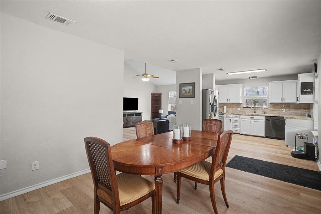 323 Sage Trail Springtown, TX 76082 - Photo 11 of 32 a view of a dining room with furniture and wooden floor