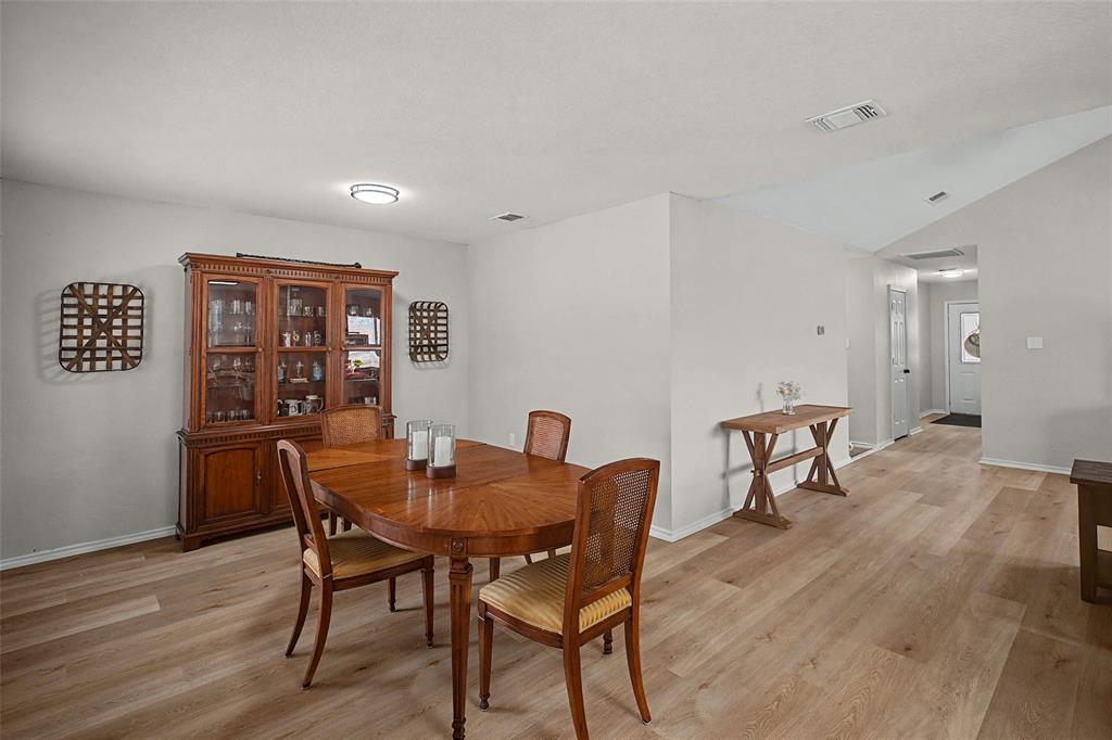 323 Sage Trail Springtown, TX 76082 - Photo 17 of 32 a view of a dining room with furniture and wooden floor