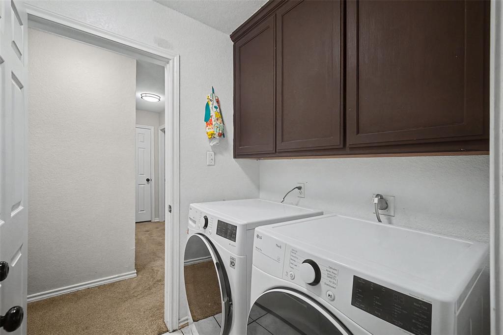 323 Sage Trail Springtown, TX 76082 - Photo 19 of 32 a utility room with dryer and washer