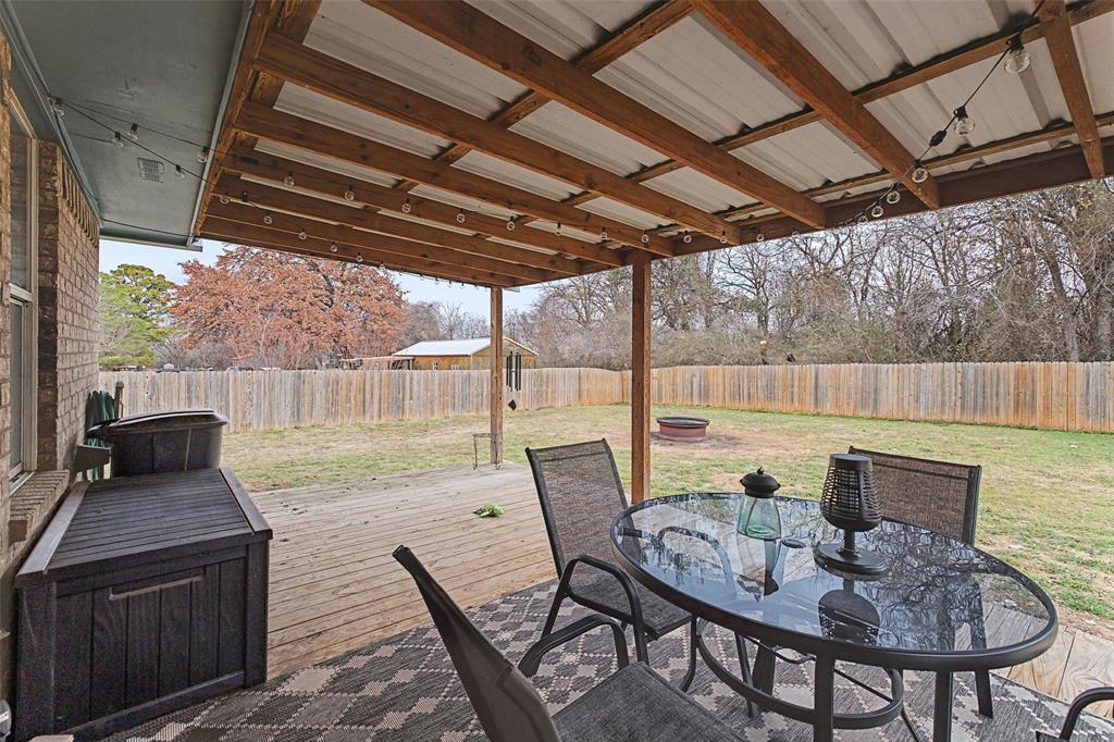 323 Sage Trail Springtown, TX 76082 - Photo 27 of 32 a outdoor dining space with furniture