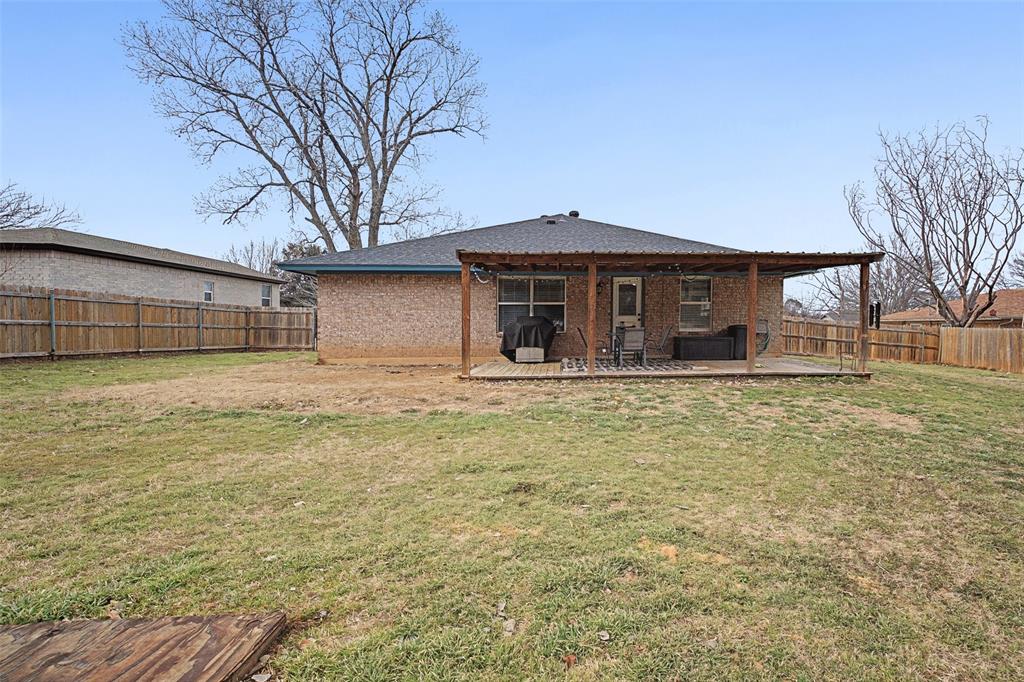 323 Sage Trail Springtown, TX 76082 - Photo 29 of 32 a front view of a house with a yard