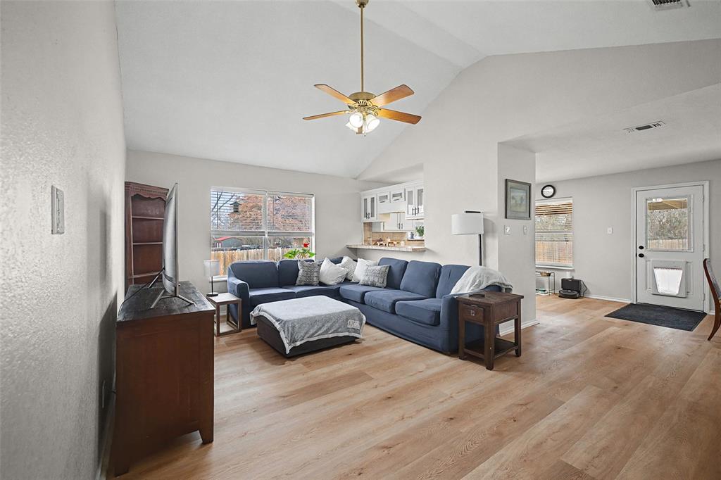 323 Sage Trail Springtown, TX 76082 - Photo 8 of 32 a living room with furniture a ceiling fan and a window