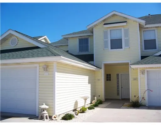 a front view of a house with a garage
