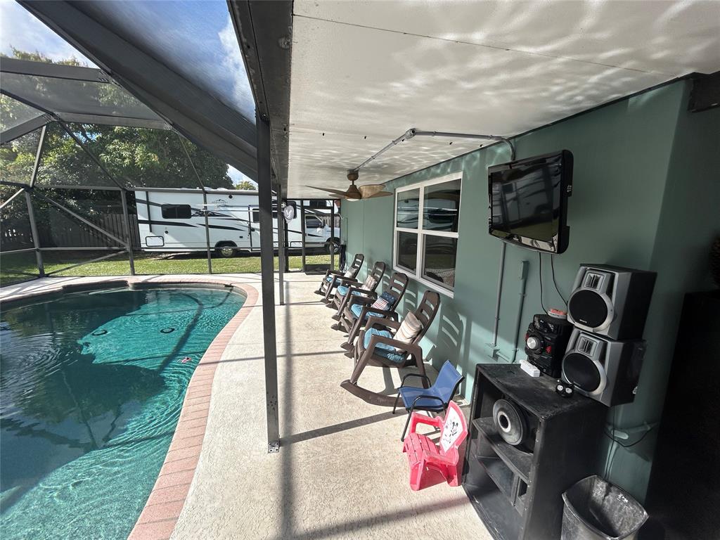 9548 Richmond Circle Boca Raton, FL 33434 - Photo 12 of 38 a view of a swimming pool with a patio