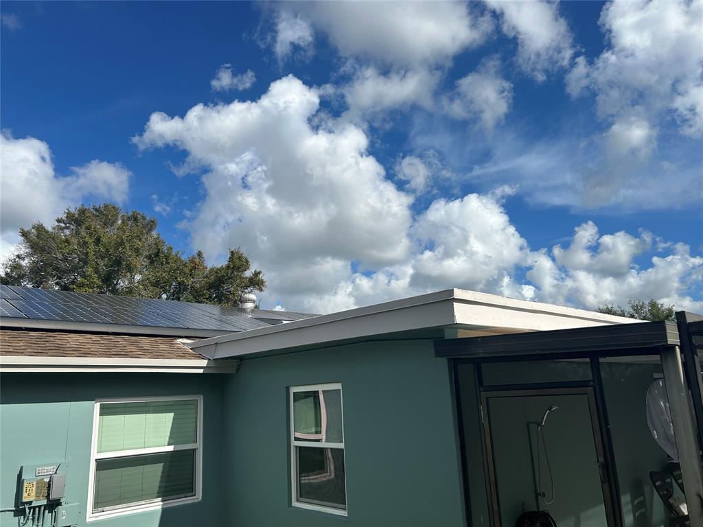 9548 Richmond Circle Boca Raton, FL 33434 - Photo 13 of 38 a kitchen with a sink and dishwasher next to a yard