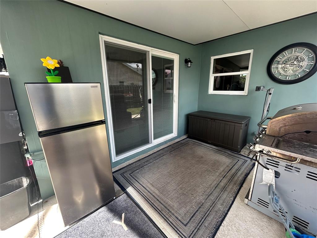 9548 Richmond Circle Boca Raton, FL 33434 - Photo 14 of 38 a living room with a bed furniture and a window