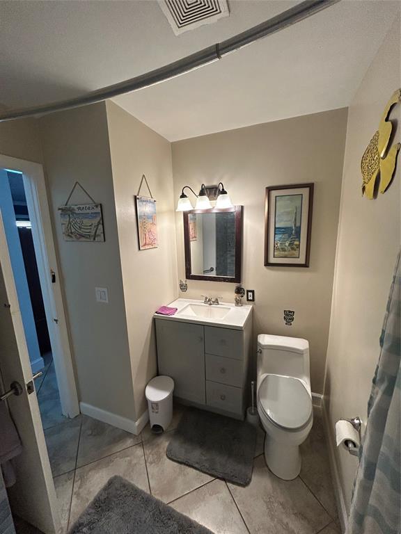 9548 Richmond Circle Boca Raton, FL 33434 - Photo 30 of 38 a bathroom with a toilet sink and mirror