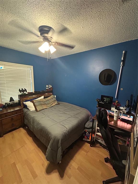 9548 Richmond Circle Boca Raton, FL 33434 - Photo 32 of 38 a bedroom with a bed and a chandelier