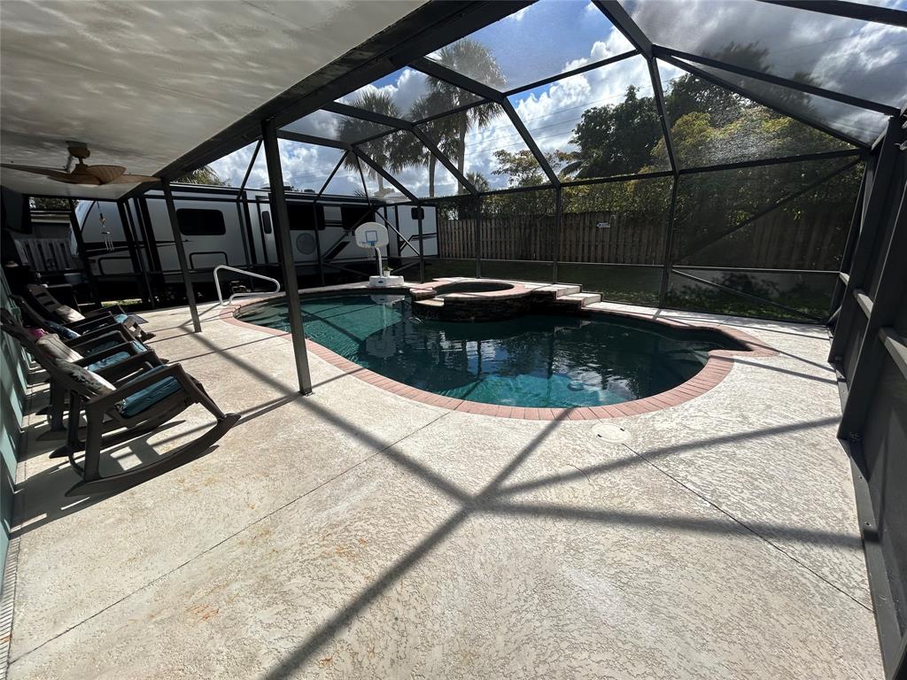 9548 Richmond Circle Boca Raton, FL 33434 - Photo 9 of 38 a room with water heater and wooden walls