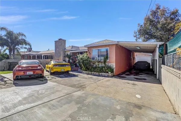 a view of car parked in front of house