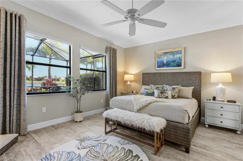 1434 Redona Way Naples, FL 34113 - Photo 16 of 47 a bedroom with a bed and a window