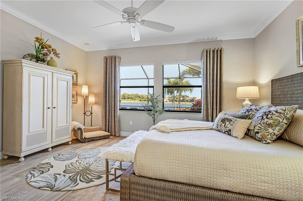 1434 Redona Way Naples, FL 34113 - Photo 17 of 47 a bedroom with a bed and wooden floor