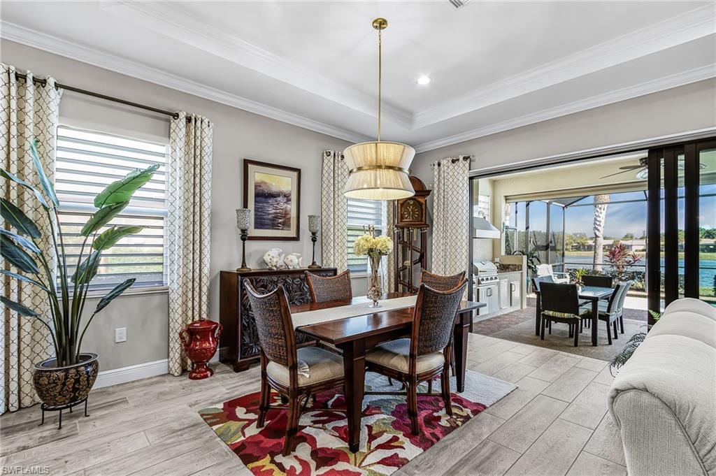 1434 Redona Way Naples, FL 34113 - Photo 26 of 47 a view of a dining room with furniture window and outside view