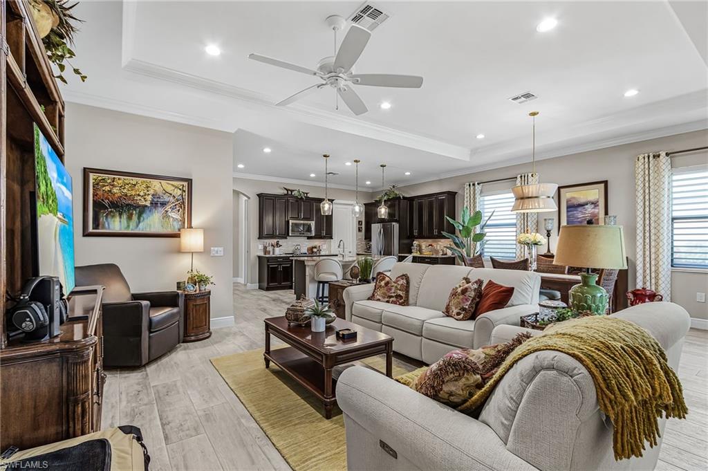 1434 Redona Way Naples, FL 34113 - Photo 28 of 47 a living room with furniture kitchen view and a window