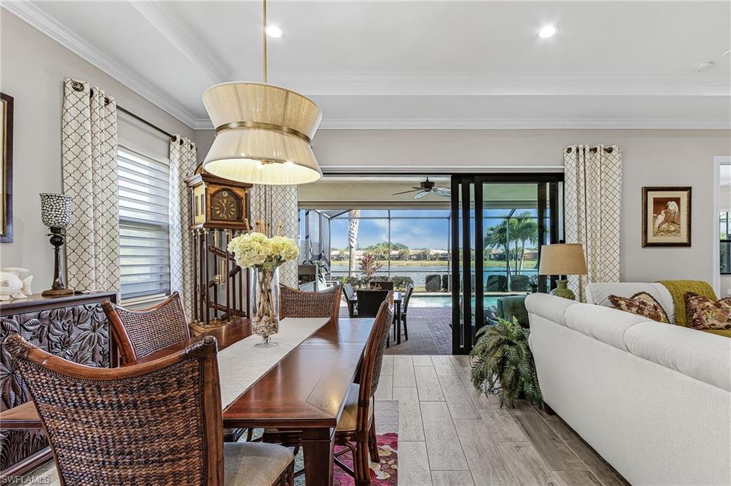 1434 Redona Way Naples, FL 34113 - Photo 29 of 47 a dining room with furniture and wooden floor