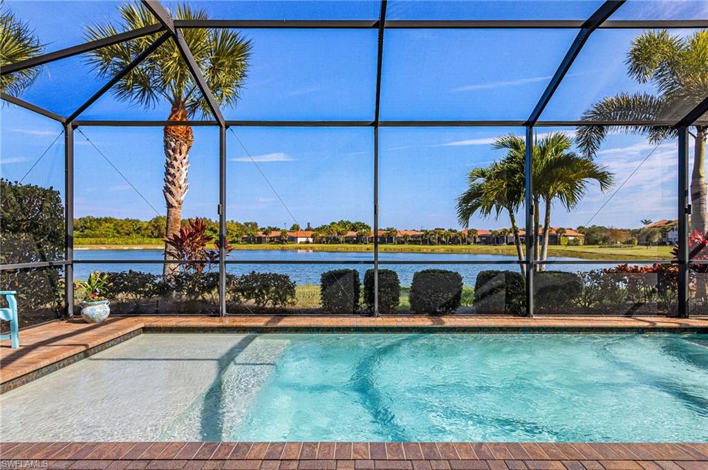 1434 Redona Way Naples, FL 34113 - Photo 34 of 47 a view of a house with a yard