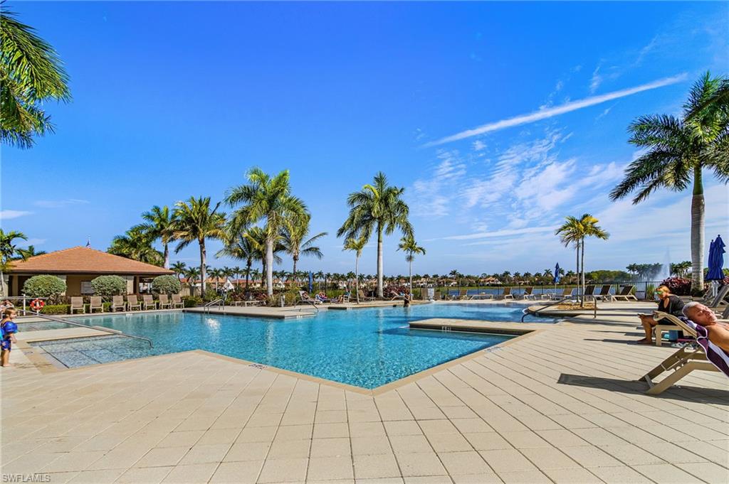1434 Redona Way Naples, FL 34113 - Photo 36 of 47 a view of swimming pool with outdoor seating and plants