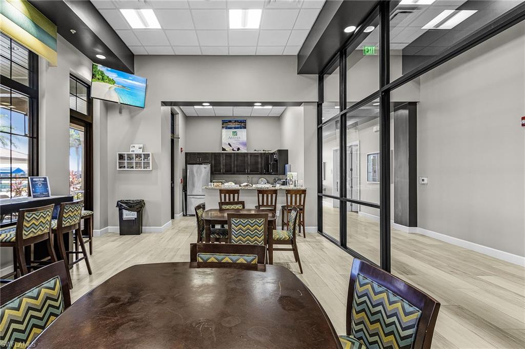 1434 Redona Way Naples, FL 34113 - Photo 39 of 47 a view of living room with furniture and flat screen tv