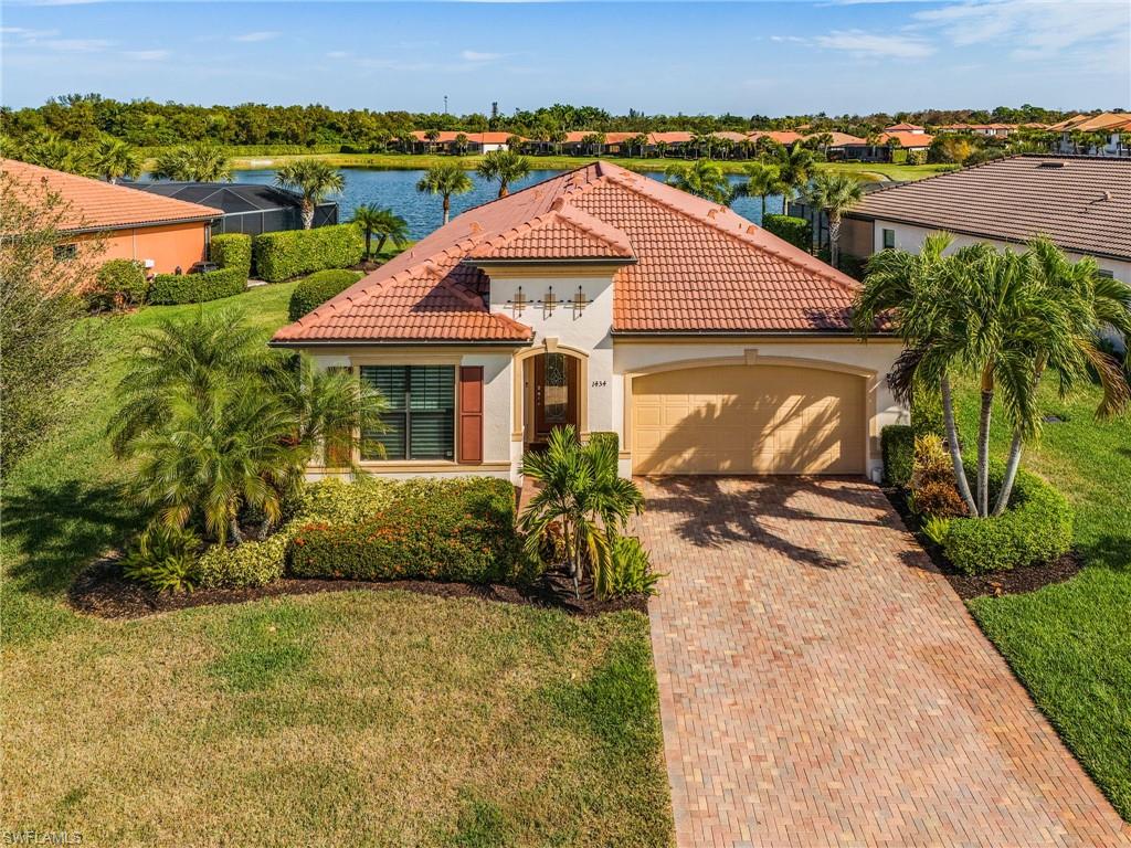 1434 Redona Way Naples, FL 34113 - Photo 41 of 47 an aerial view of a house with a yard