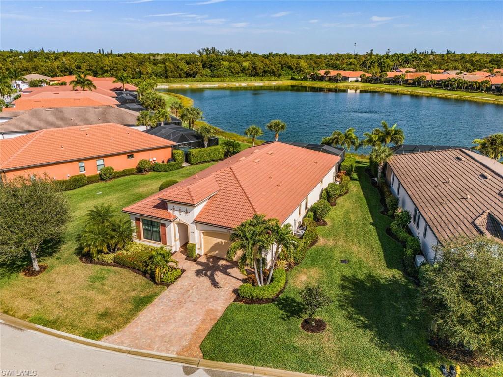 1434 Redona Way Naples, FL 34113 - Photo 42 of 47 an aerial view of a house with outdoor space and lake view in back