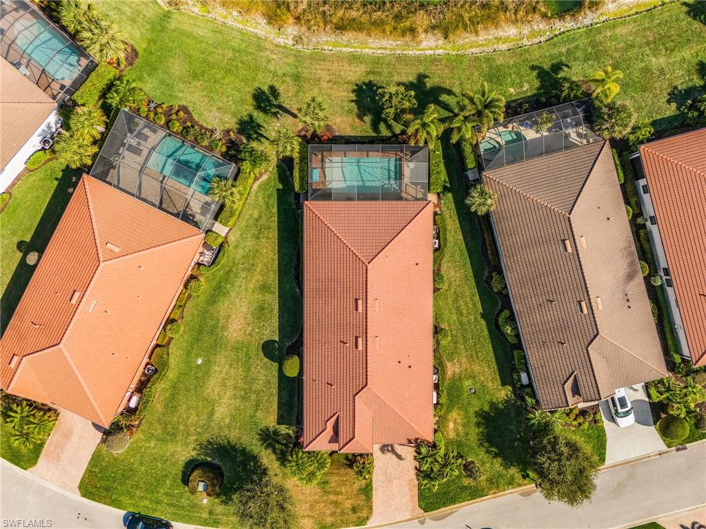 1434 Redona Way Naples, FL 34113 - Photo 43 of 47 an aerial view of residential houses with outdoor space