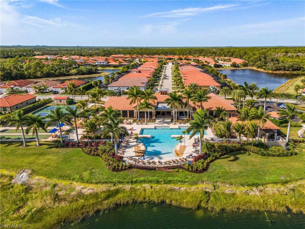 1434 Redona Way Naples, FL 34113 - Photo 45 of 47 a view of a lake with houses