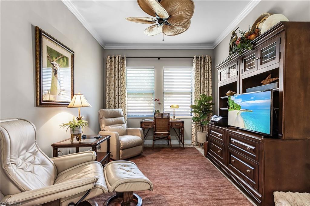 1434 Redona Way Naples, FL 34113 - Photo 8 of 47 a living room with furniture and a flat screen tv