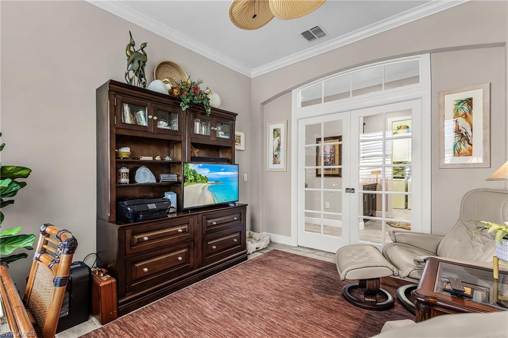 1434 Redona Way Naples, FL 34113 - Photo 9 of 47 a living room with furniture and wooden floor