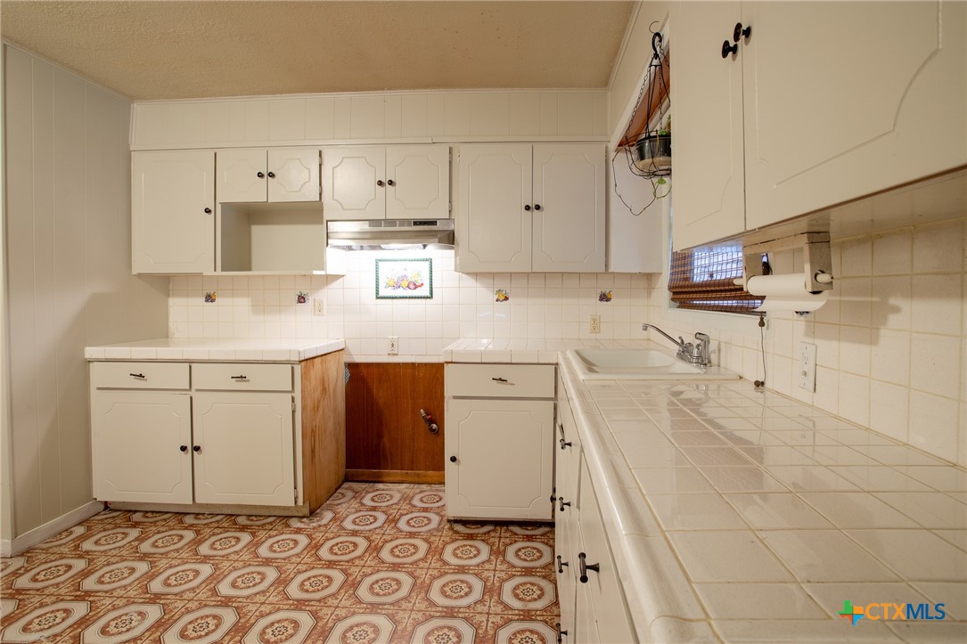 2903 Gayle Street Victoria, TX 77901 - Photo 7 of 21 a kitchen with a sink cabinets and window